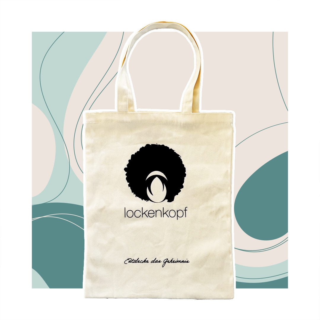 Tote Bag – “Entdecke das Geheimnis” lockenkopf Tote Bag – “Entdecke das Geheimnis” ist ein Accessoire für die Lockenpflege bei lockenkopf.com